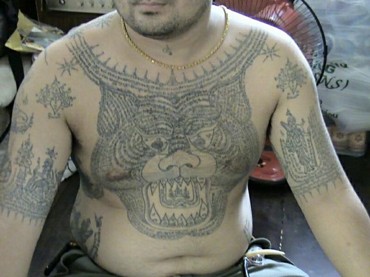 tiger-tattoo. Sak Yant Tiger. Tiger head on chest tattooed