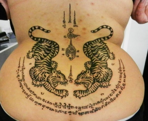 Sak Yant Suea Koo tattooed on the lower back